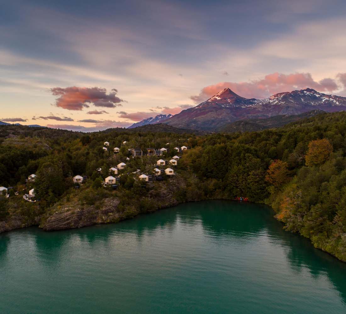 Exterior view of Patagonia Camp surrounded by native Patagonian landscape.