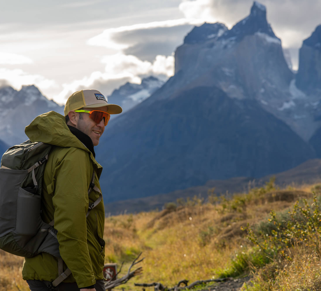 Person overlooking the Patagonia mountain range of Los Cuernos del Paine